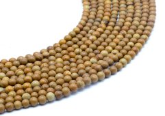 Koraliki z drewna kopalnego 4 mm na nitce 40 cm